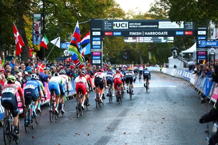 Crowds support the riders in Harrogate as the back of peloton pass the finish line for the first time